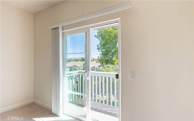 Deck off this bedroom with views toward the hills