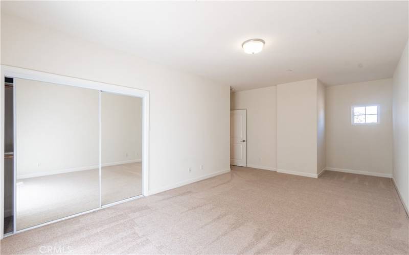 Upstairs bedroom with mirrored doors