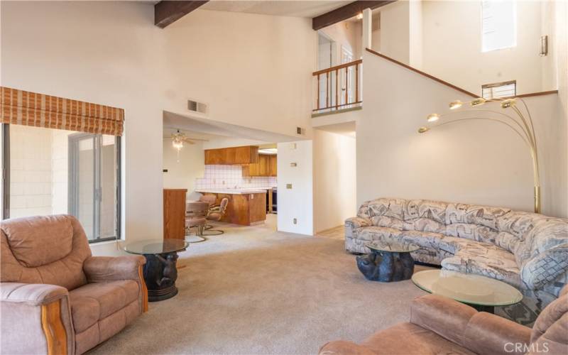 The great room is open to the kitchen as well as the upstairs hallway