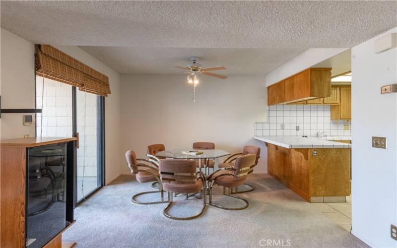 Eat in or out.  This dining area has slider access to a covered patio.