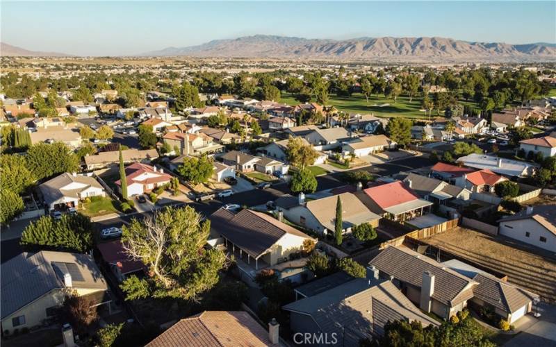 Drone shot showing the golf course nearby.