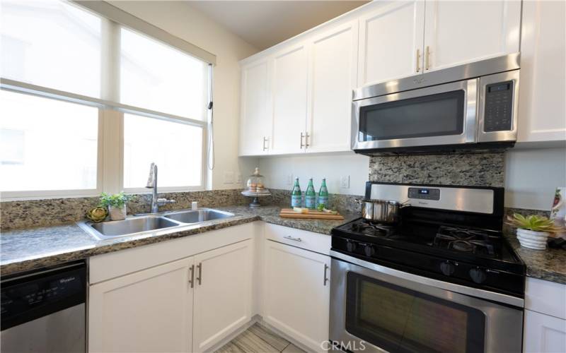 Kitchen with Stainless Steel Appliances, including Fridge