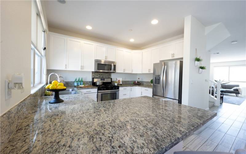 Kitchen with Stainless Steel Appliances, including Fridge