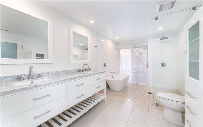 Master bathroom with dual sink, infinity shower and standing bath tub.