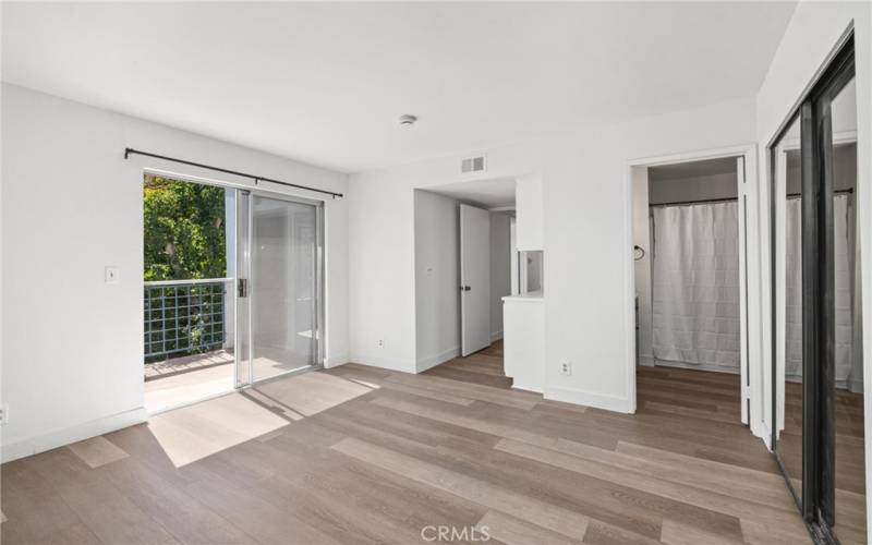 Primary bedroom with balcony