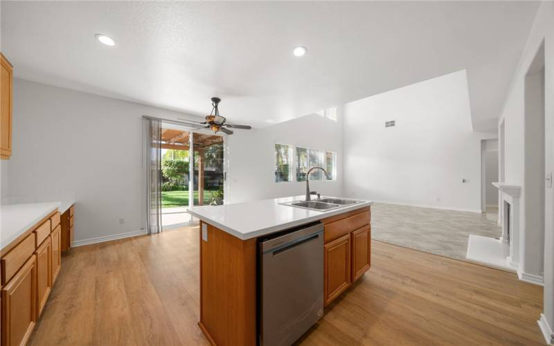 Kitchen opens into family room. recessed lighting.