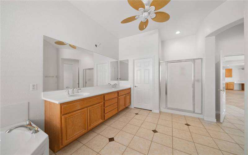 Primary bathroom.Beautiful tile and double sink area