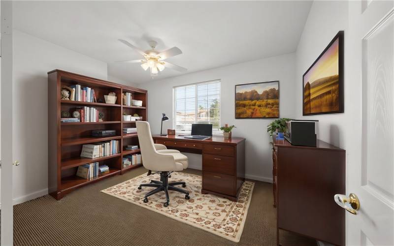 Bedroom downstairs that could be an office. Double doors and window, no closet area. Virtually staged