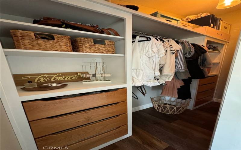 Bedroom 1 closet with custom closet and barn door