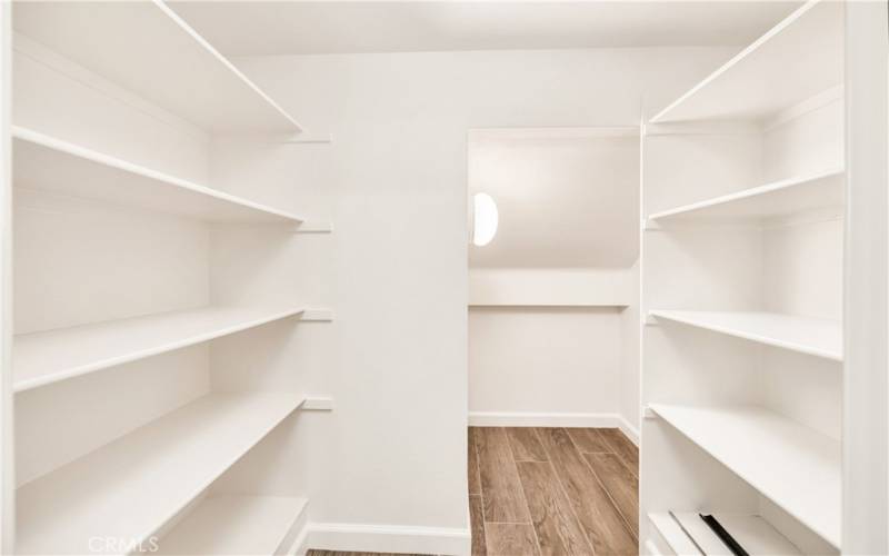 Walk-in kitchen pantry.