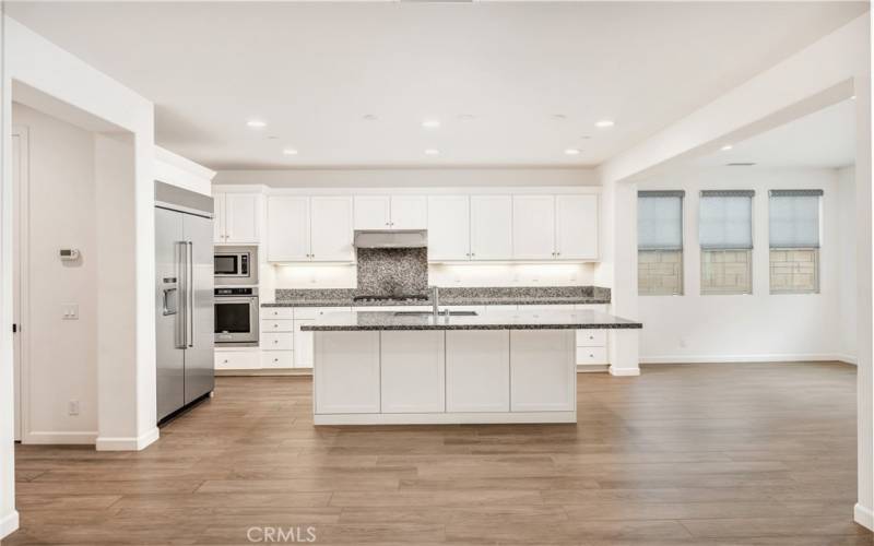 Family room opens to kitchen and dining area.