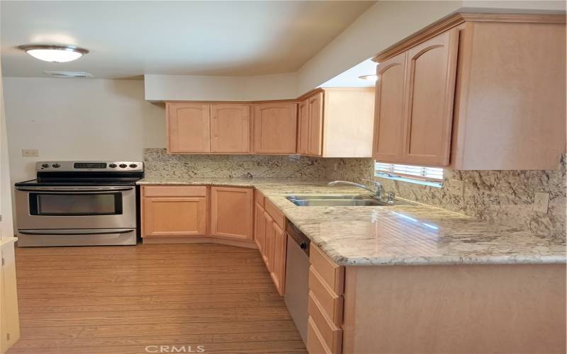 Gorgeous granite counter tops and newer custom made maple cabinetries