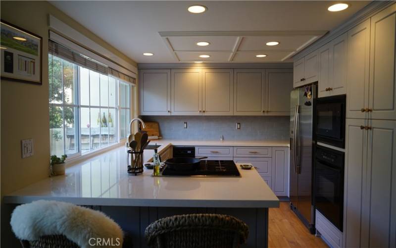 Updated designer kitchen with quartz countrs and lt gray cabinets