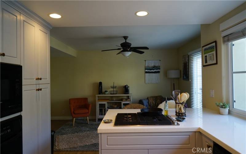 Kitchen open to family room and balcony