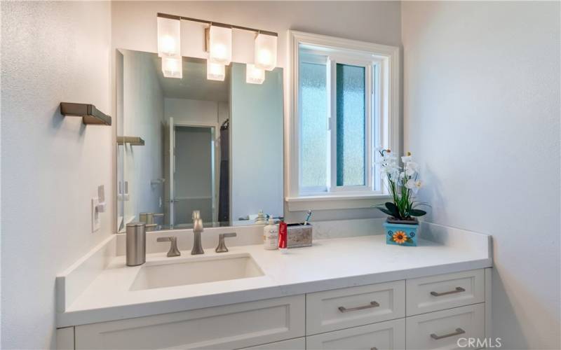 This bathroom is very modern and bright, and the natural light makes it even more inviting.