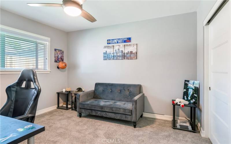 This is the second bedroom in the house. It's currently being used as an extra lounge space, but it could easily be transformed into a beautiful bedroom.