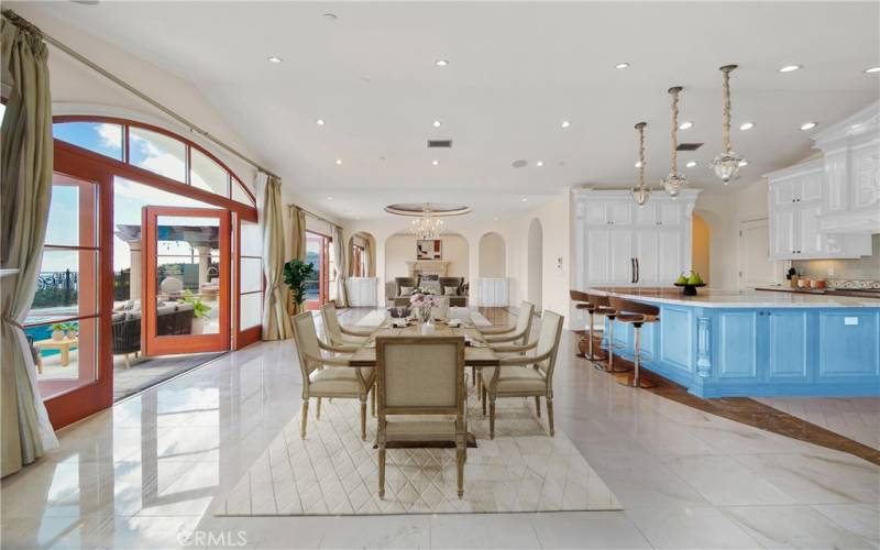 Open floor plan with dining room with views of pool, city and ocean.