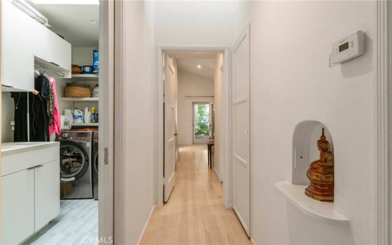 separate laundry room and hallway to bedrooms