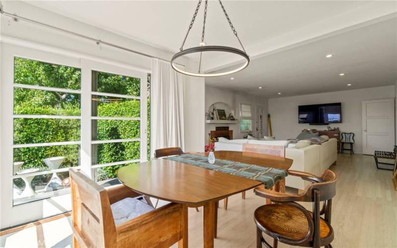 dining room with french doors to private patio and living area