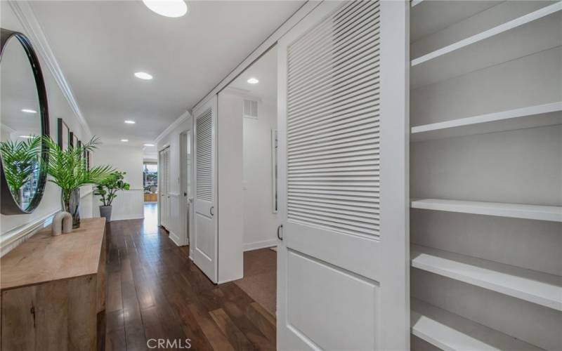 Hallway from entry leading to main living area - doors to the right are at the Den/Office