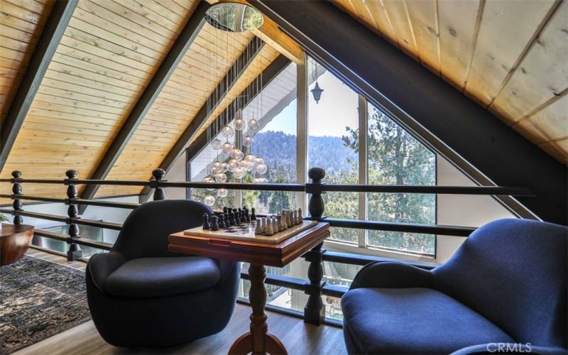 The black beams look so sharp against the natural-wood ceiling