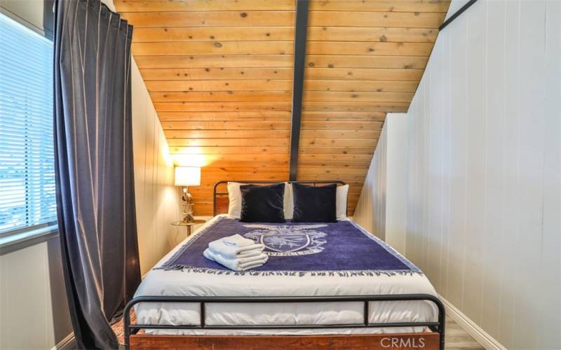 Bedroom 1: Loft with cathedral ceilings