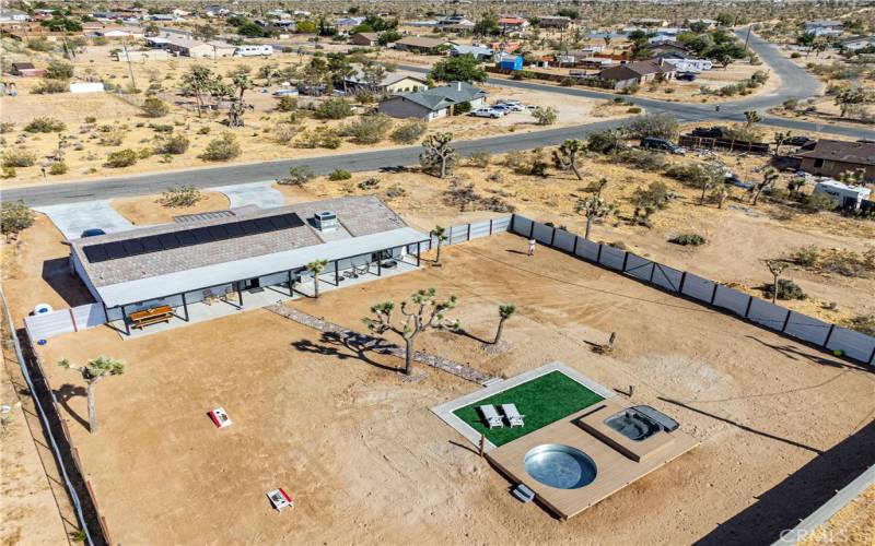 Drone view of backyard, fenced in, on one acre
