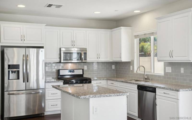 White Shaker cabinets and gleaming stainless appliances!