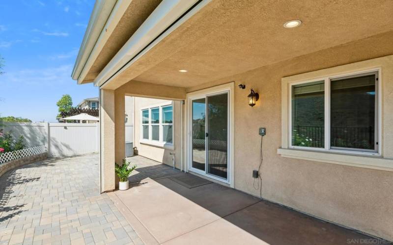 Covered patio with remote control electric shades.