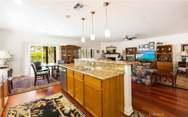 KITCHEN - OPEN LIVING VIEW TO FAMILLY ROOM