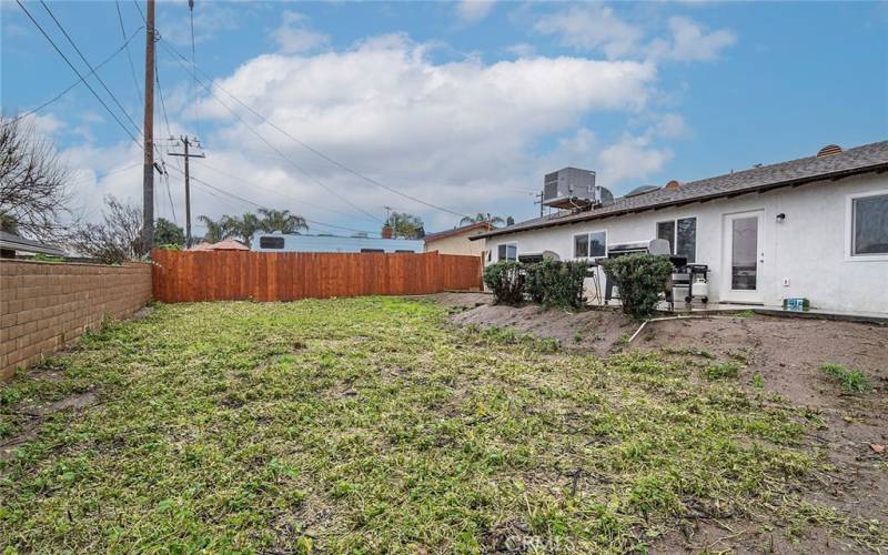 Large RV Parking beyond wooden fence