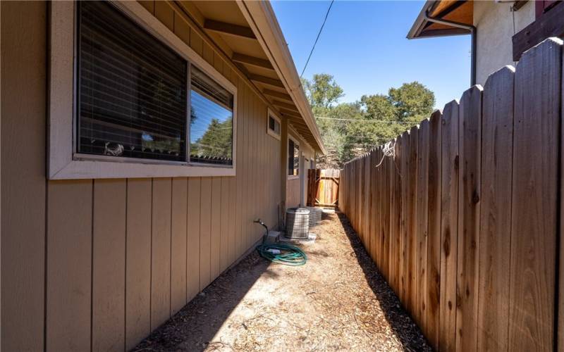 On the other side of the home is a side yard that could be used as a dog run or storage area.