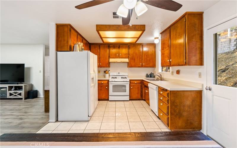 Well appointed kitchen offers plenty of cabinet space for storage.