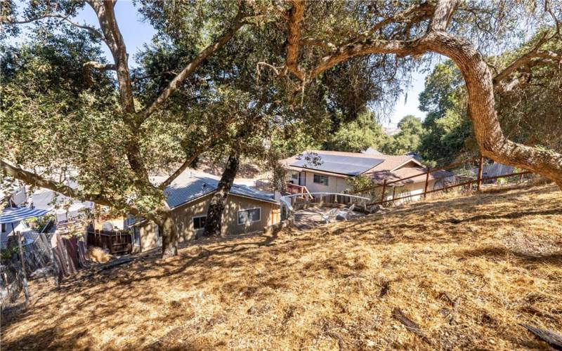 Beautiful oak trees shade the property.