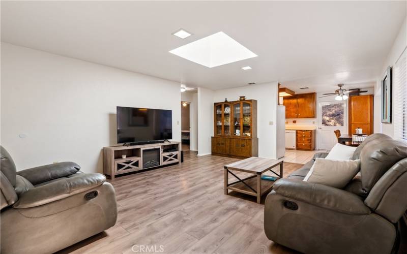 Stepping inside you are greeted by newer (~ 4 years new) laminate wood floors.