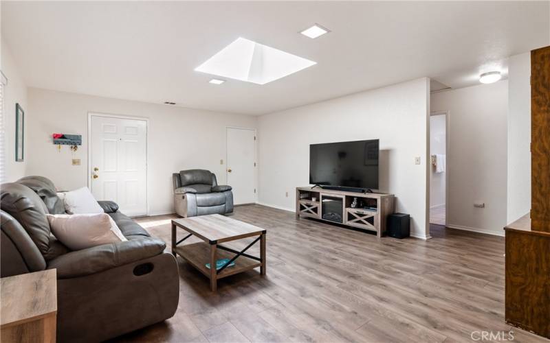 Plenty of room o spread out and relax. Door on the left is the front door, door on the right leads to the garage and the hallway leads to bedrooms and bathroom.