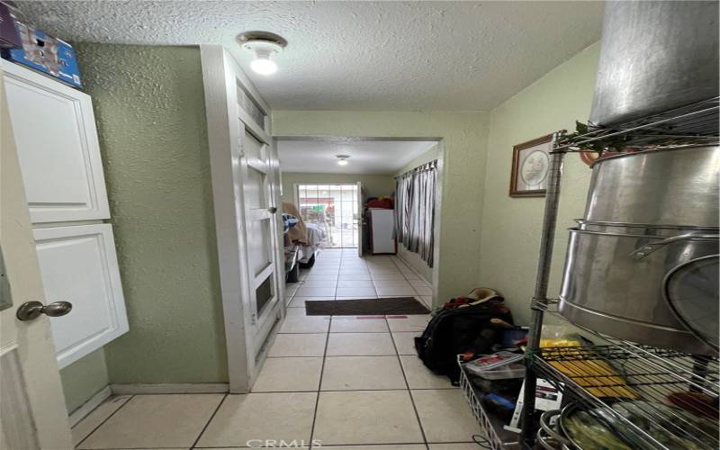 hallway past kitchen with pantry space