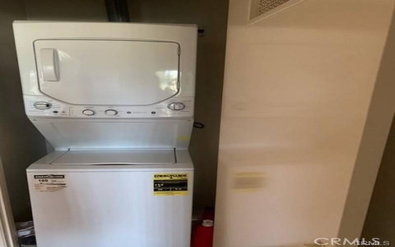 Stackable washer dryer is located in the condo