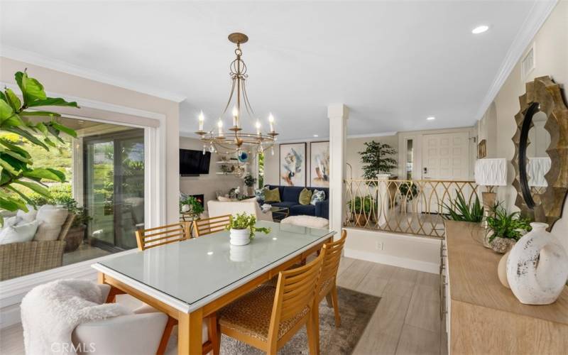 Dining enclave has open floor plan feel with natural lighting, newer flooring, and amazing views.