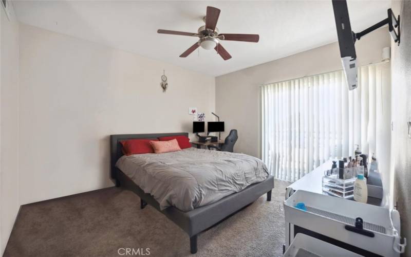 Primary bedroom with access to balcony