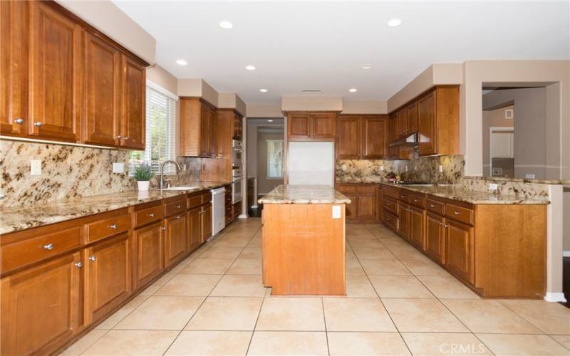 Kitchen featuring an island and ample cabinet space