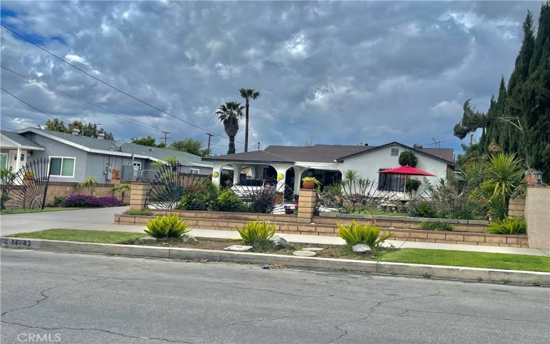 Gated home with deep front yard and driveway