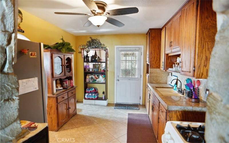 Kitchen with access to covered patio