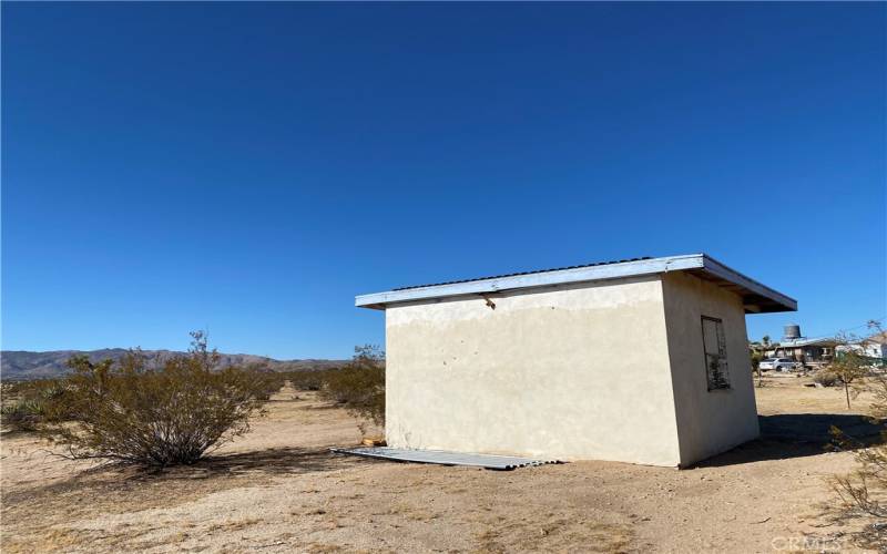 Good bones for a remodel for this recreational cabin with stucco siding.