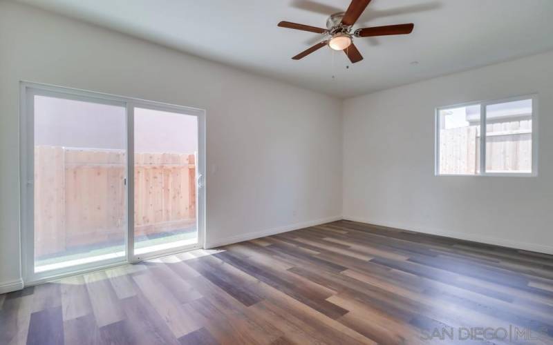 The two previous pictures are of the main floor bedroom and how neat it would be for guests or inlaws. This bedroom includes a large walk in closet and its own slider to enjoy the outside.