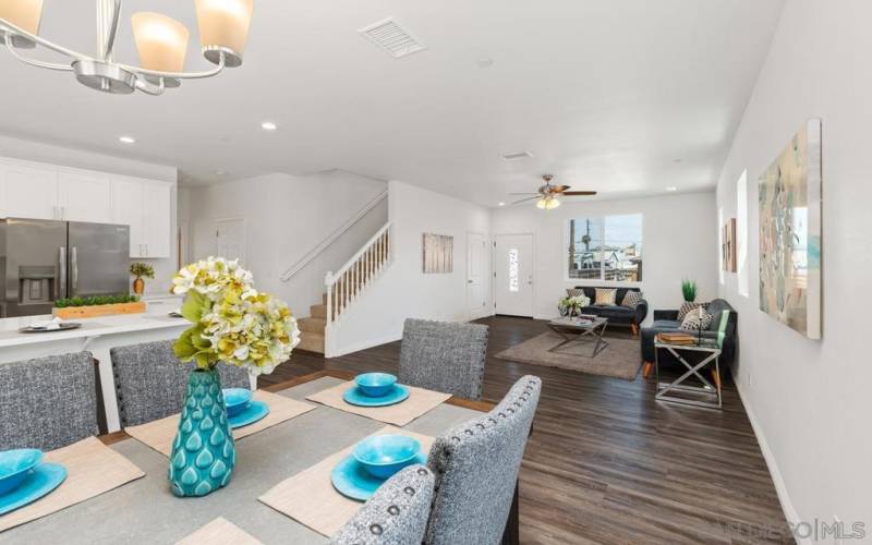 Looking from dining to the living room area and to your left in the picture to the kitchen.  What you don't see is the full bathroom and large bedroom with a walk in closet on this same floor.