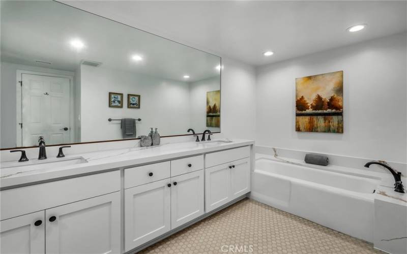 Master Bath with bathtub and dual sinks