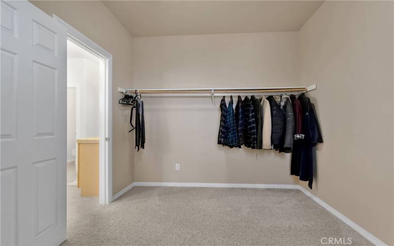 Primary bedroom closet is an entire dressing room.