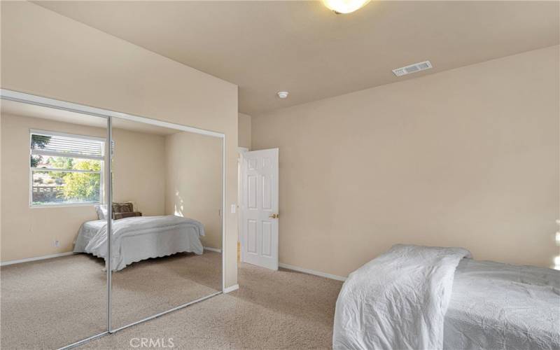 Bedrooms are all oversized with mirrored closet doors and high ceilings.