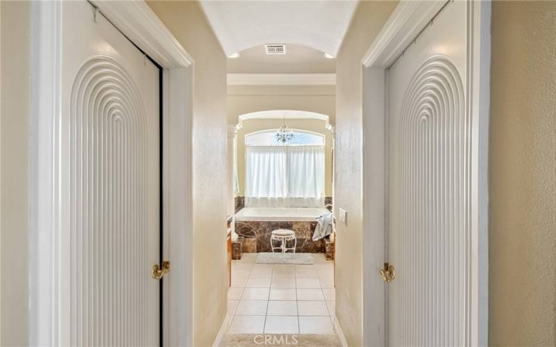 Walk-in closets right and left as you head to the en-suite